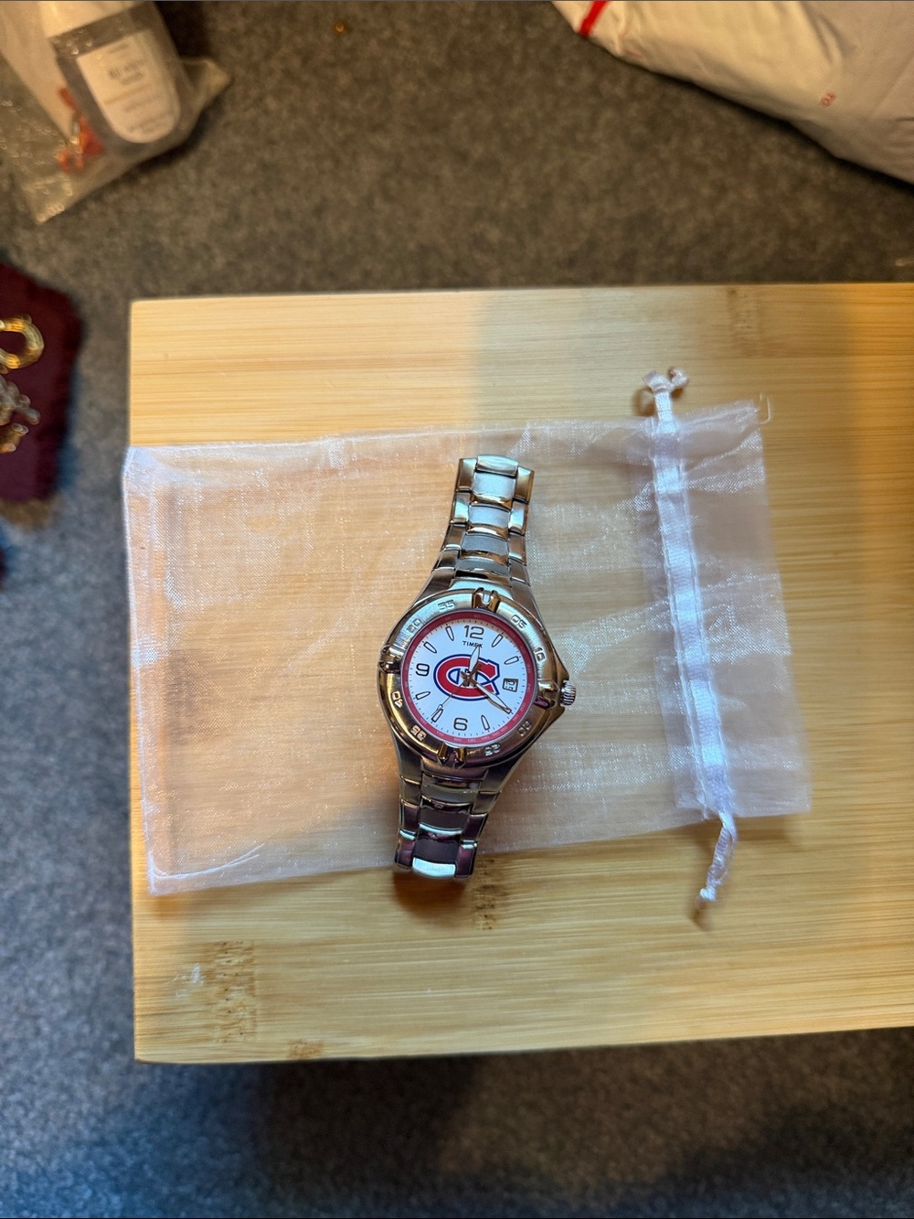 Silver Metal Wristwatch with Red and White Dial